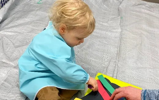 a child playing with a toy