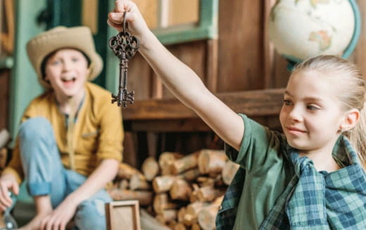 a person and a girl holding a snake