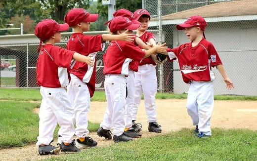 a group of kids in red uniforms