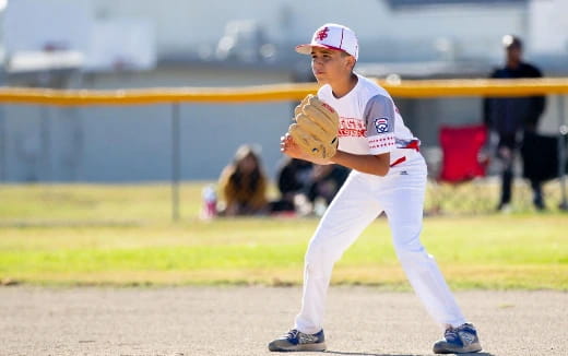 a young boy playing baseball