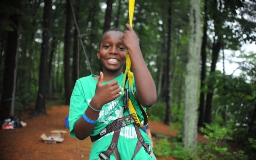 a person holding a yellow rope