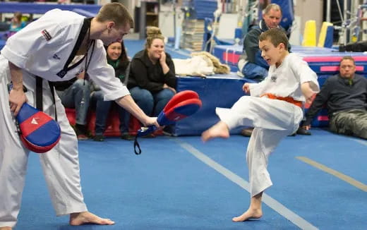 a group of people in karate uniforms