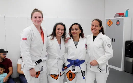 a group of women in white lab coats