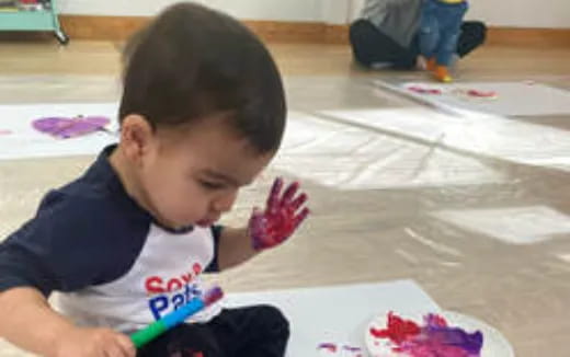 a child coloring on paper