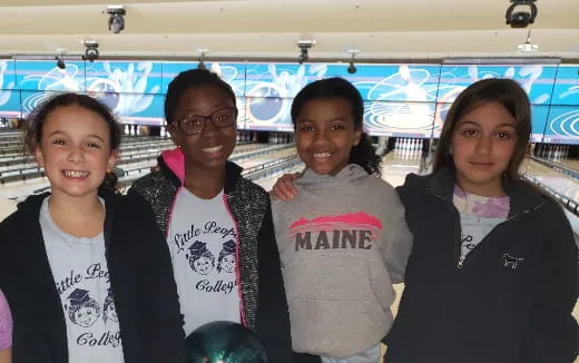 a group of girls posing for a photo