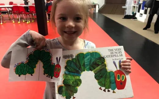 a child holding a sign