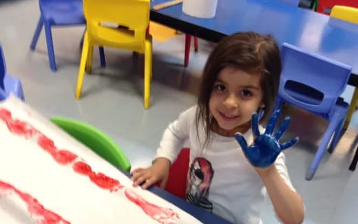 a girl sitting at a table