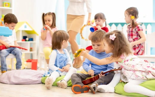 a group of children sitting on the floor