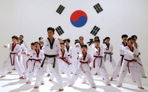 a group of people in karate uniforms