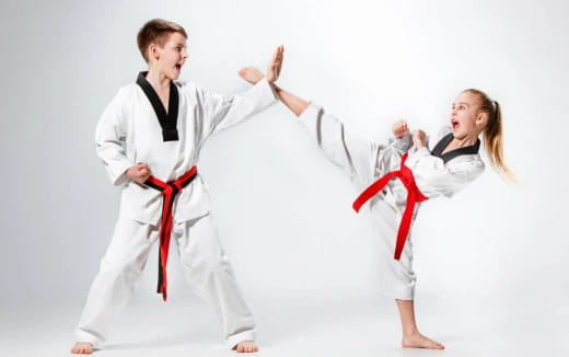 a man and a woman in karate uniforms