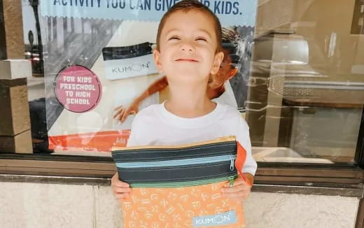 a child in a yellow apron