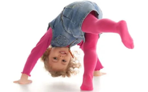 a girl doing a handstand
