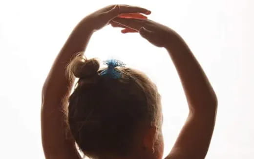 a person with a flower in the hair