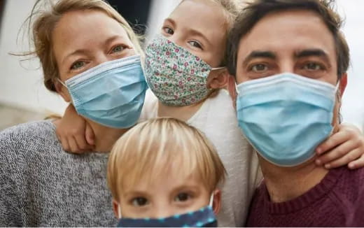 a group of people wearing surgical masks