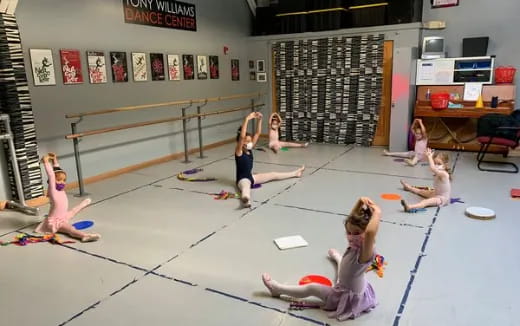 a group of women exercising in a gym