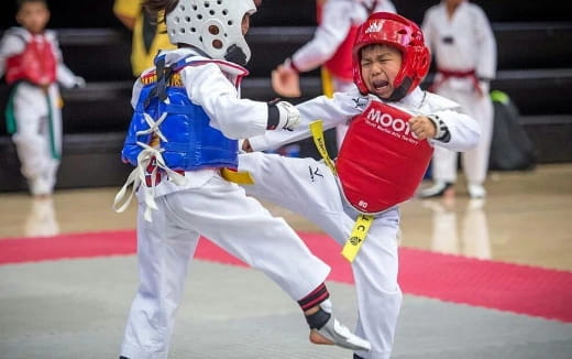 a couple of men in helmets fighting