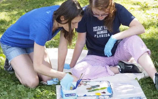 a few women doing a science experiment