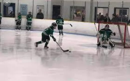 a group of people playing hockey