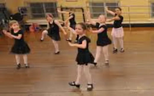 a group of girls performing on roller blades