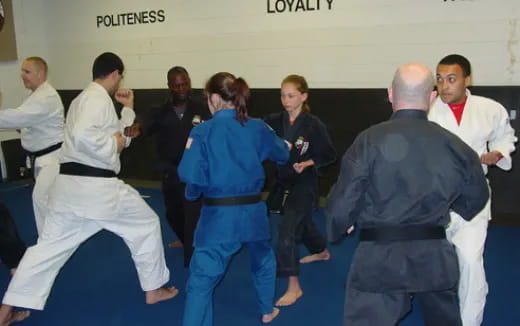 a group of people in karate uniforms