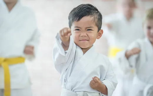 a young boy in a white shirt