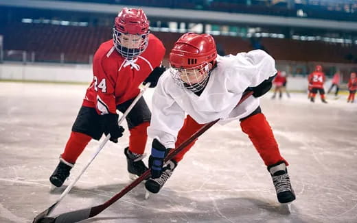 two men playing hockey