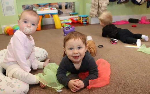 a group of children lying on the floor