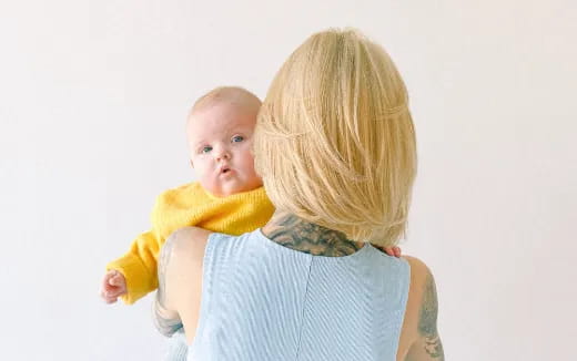 a person holding a baby