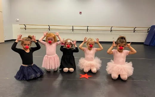 a group of girls wearing clothing