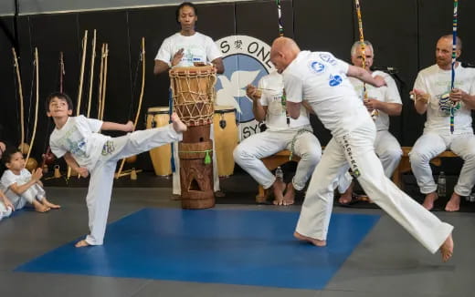 a group of people in karate uniforms