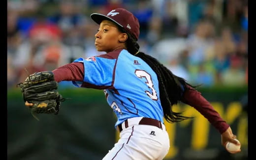 a baseball player throwing a ball