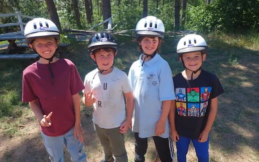 a group of kids wearing helmets
