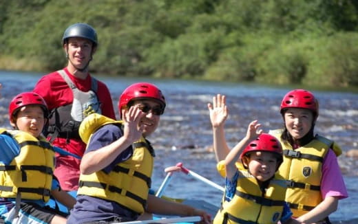 a group of people in a raft