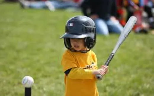 a young boy playing baseball