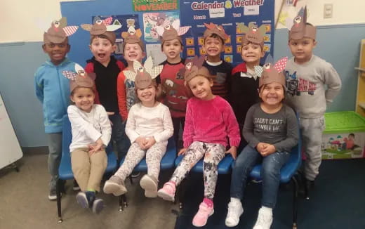 a group of children wearing hats
