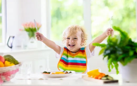 a child holding a flower