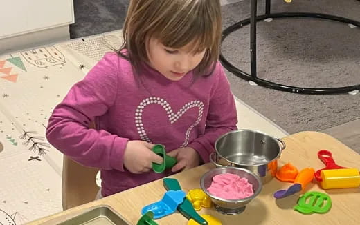 a girl making a cake