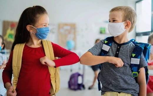 a person and a child wearing face masks