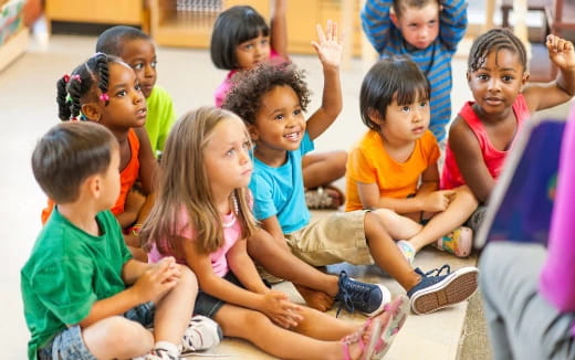 a group of children sitting on the floor