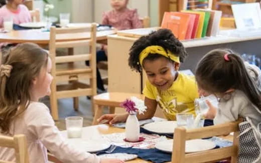 a few children sitting at a table