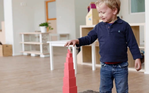 a boy playing with a toy