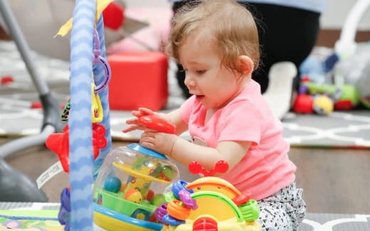 a baby playing with toys