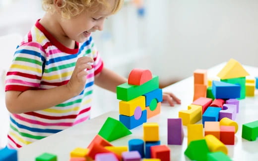 a child playing with blocks