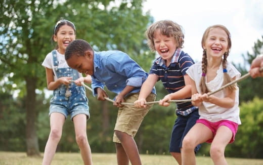 a group of children playing with sticks