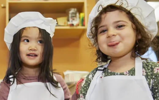 a couple of girls posing for the camera