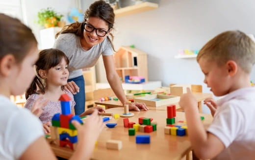 a person and children playing with toys