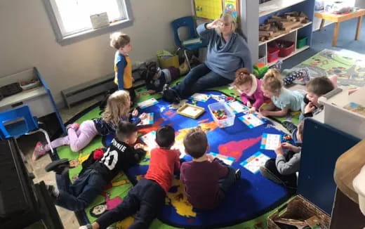 a group of children sitting on the floor