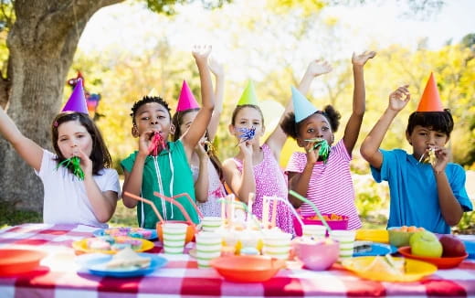 a group of people wearing party hats