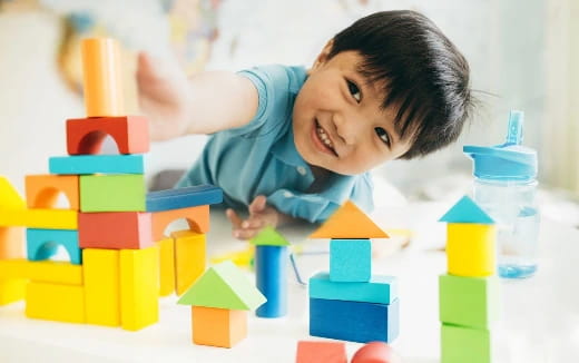 a child playing with blocks