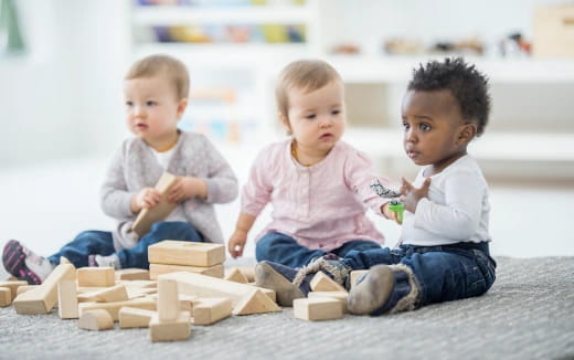 a group of children playing with blocks